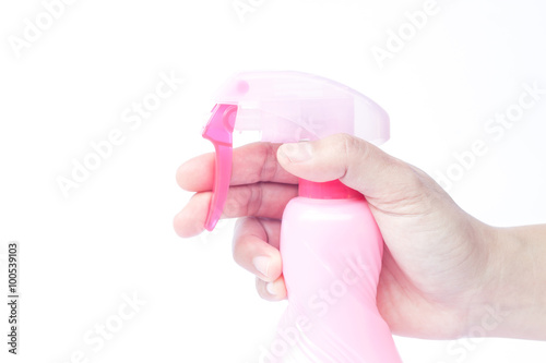 Hand holding plastic foggy spray bottle isolated on white backgr