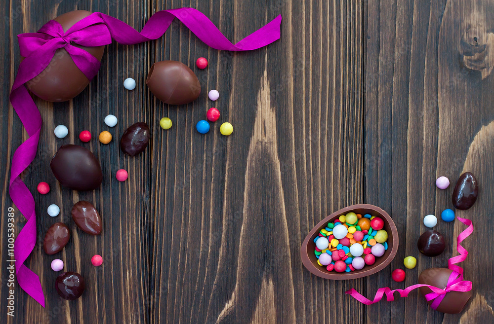 Chocolate Easter eggs over rustic wooden background. Copy space Chocolate Easter eggs over rustic wooden background. Copy space