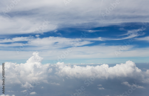 Fototapeta Naklejka Na Ścianę i Meble -  Aerial view on clouds and blue sky from airplane window