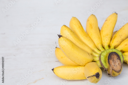 Yellow banana group on wooden background