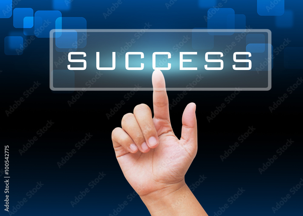 Hand pressing success button with technology background Hand pressing success button with technology background