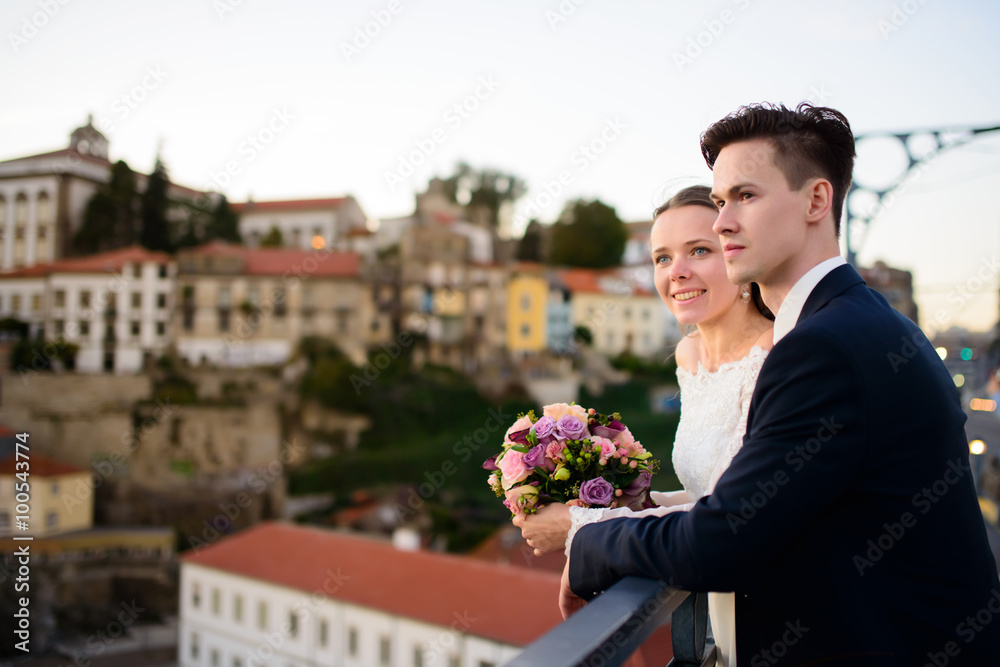 Fototapeta premium Newlyweds on background of the city Porto