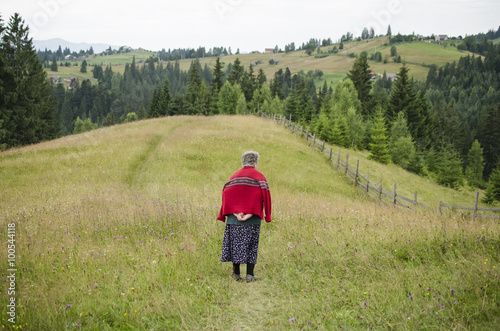 elderly woman in a field