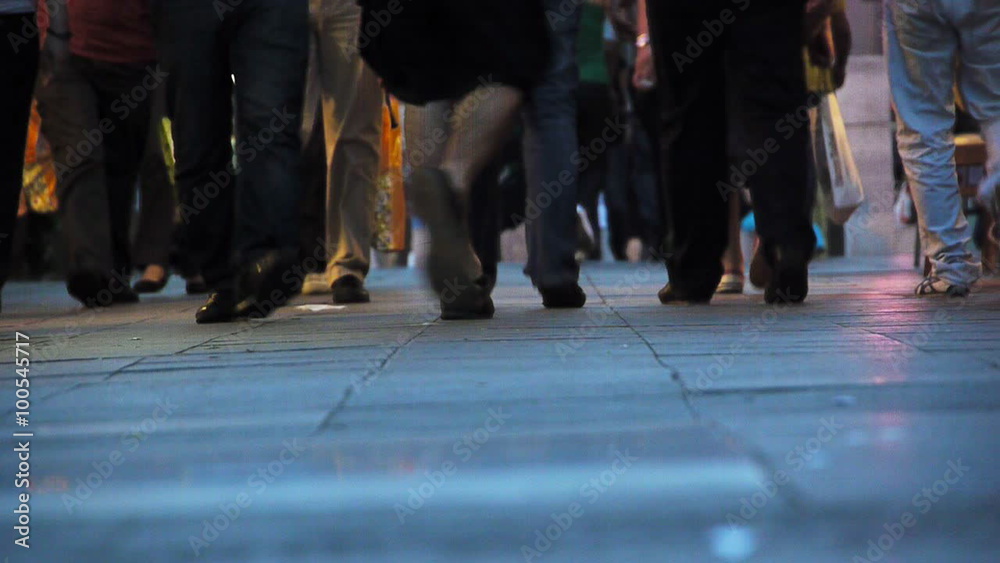 Pedestrians walking on pavement Pedestrians walking on pavement