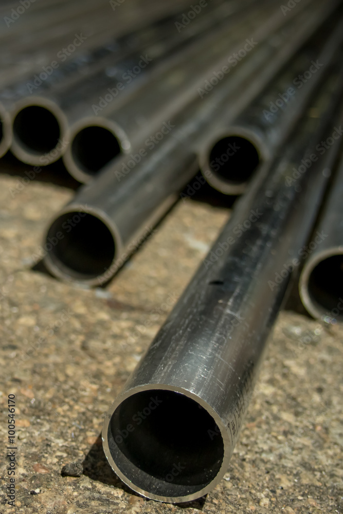 Naklejka premium Stack of Many Pipes at the Construction Site