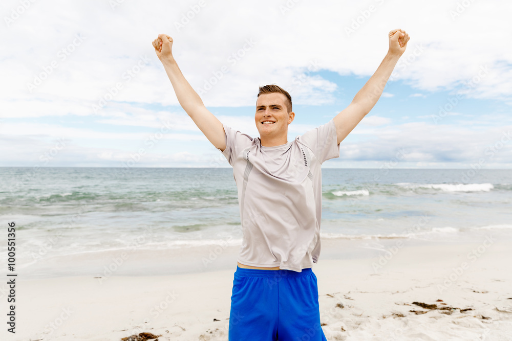 Young man in sport wear with outstretched arms Young man in sport wear with outstretched arms