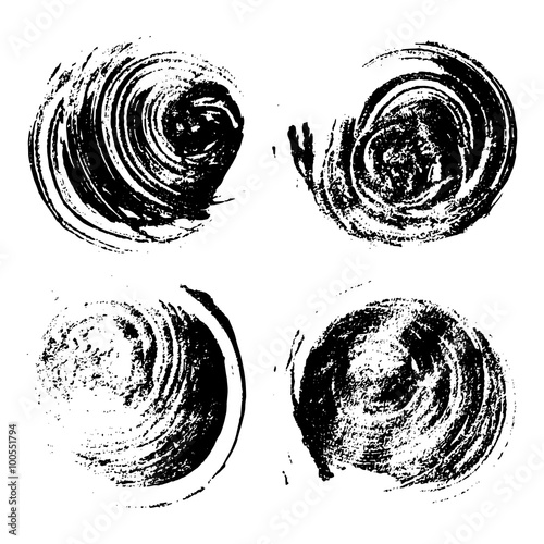 Set of four round grunge stains.