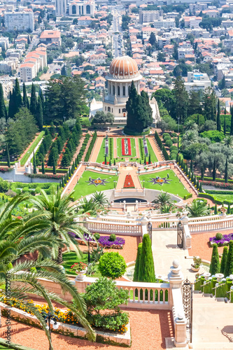 View on Bahai garden terraces with Shrine of Bab against harbor background. Haifa, Israel. photo