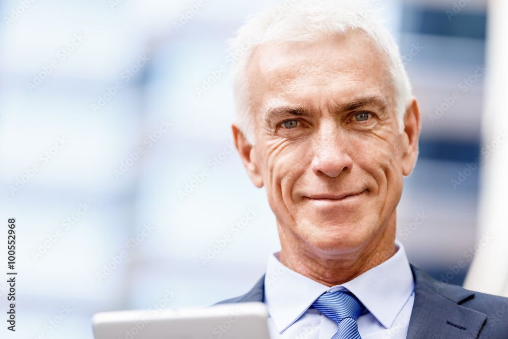 Portrait of confident businessman outdoors