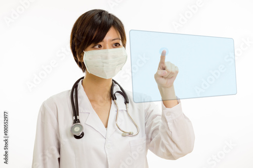 Asian female doctor pressing virtual button