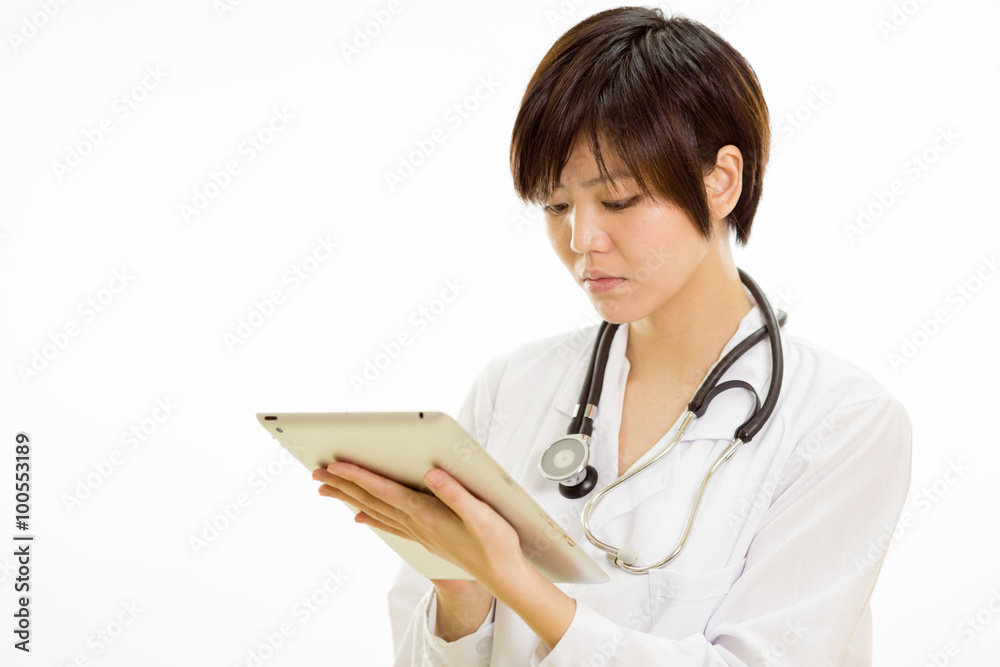 Asian female doctor using tablet computer Asian female doctor using tablet computer