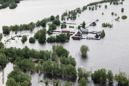 Flooded village in lowland of Great river photo