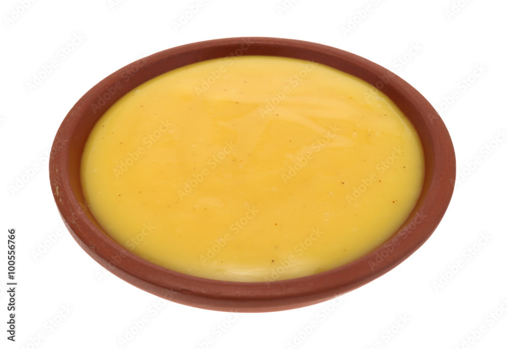 Bowl of honey mustard dressing on a white background Bowl of honey mustard dressing on a white background