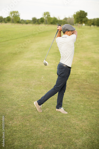 Young man playing golf