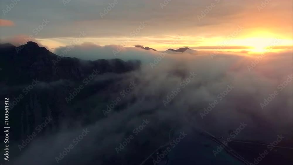 Flying on late evening above clouds on Lofoten islands in Norway. Aerial 4k Ultra HD. Flying on late evening above clouds on Lofoten islands in Norway. Aerial 4k Ultra HD.