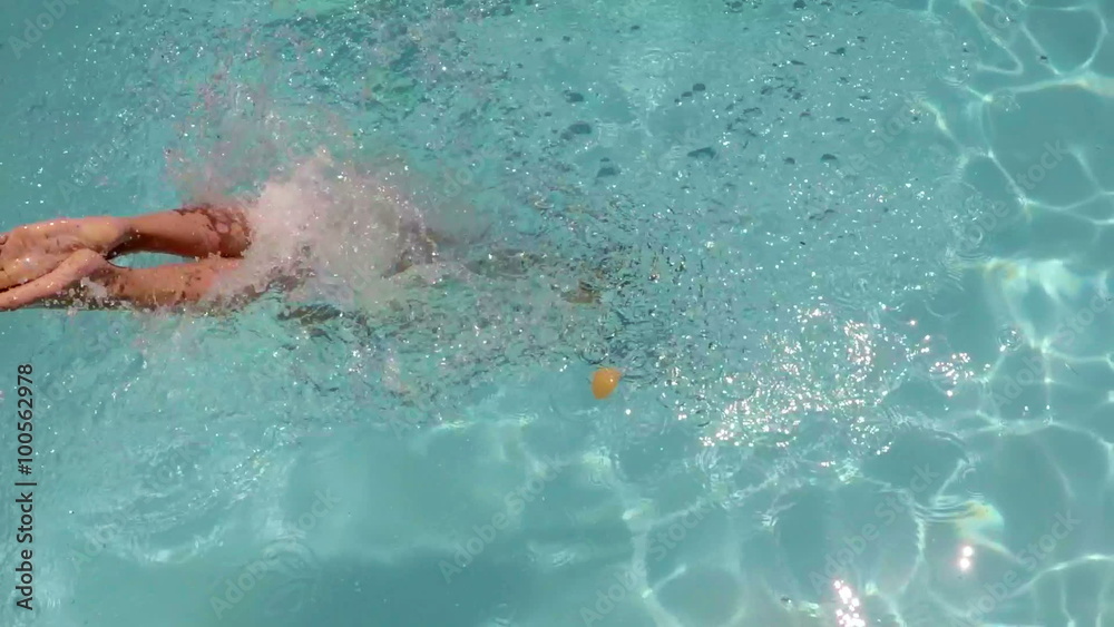Sexy woman diving into the swimming pool