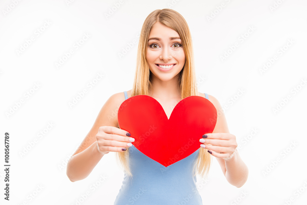 Cheerful young girl holdind big paper heart Cheerful young girl holdind big paper heart