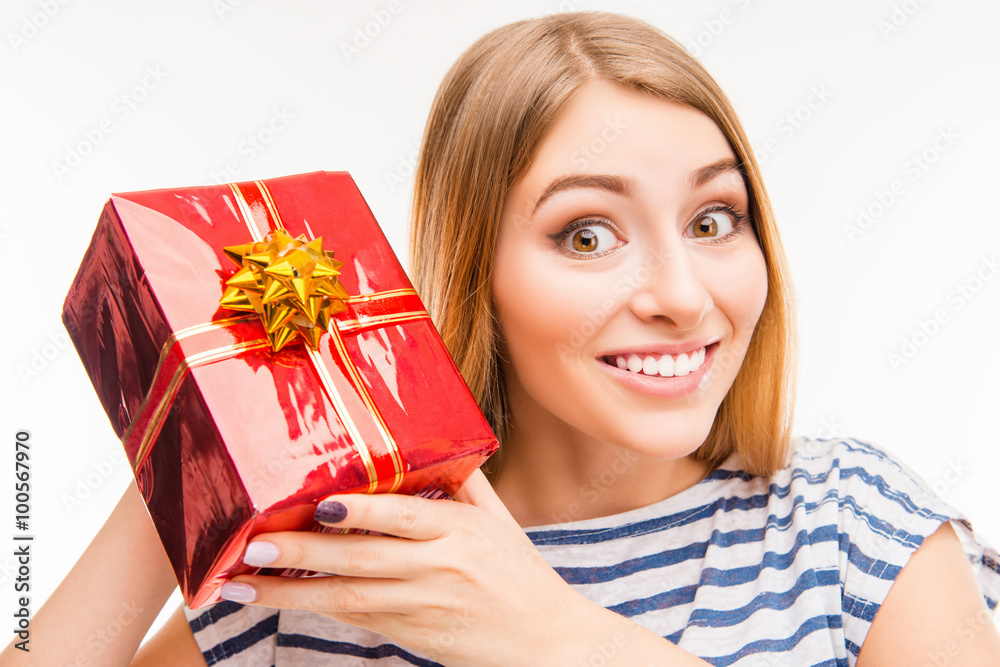 Cute girl holding present, close up photo Cute girl holding present, close up photo