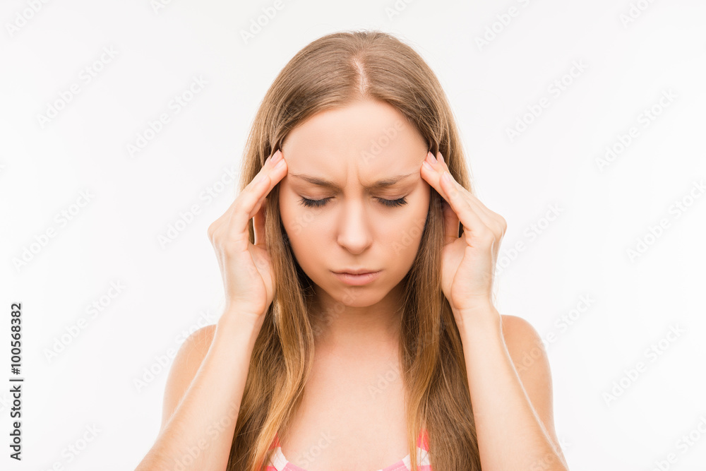 Tired young woman suffering from headache Tired young woman suffering from headache