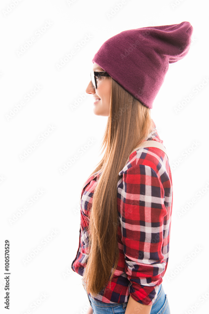 Side view photo of girl in glasses and violet cap