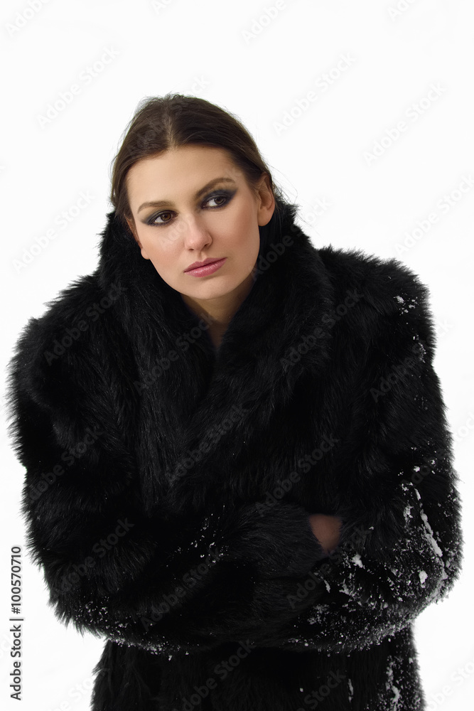 pretty girl in fur coat with snow pretty girl in fur coat with snow