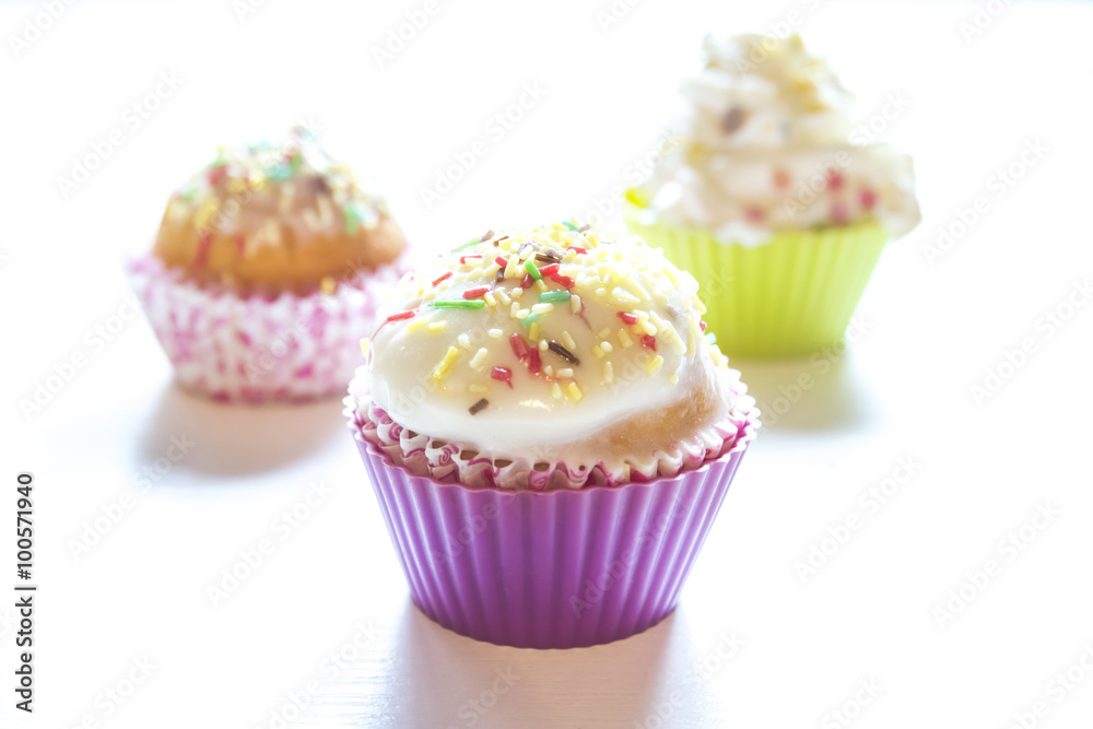 Sweet cupcakes on a white background