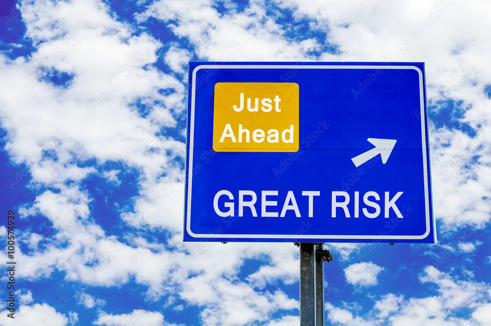 Great Risk, Just Ahead Blue Road Sign Over Dramatic Cloudy Sky Great Risk, Just Ahead Blue Road Sign Over Dramatic Cloudy Sky