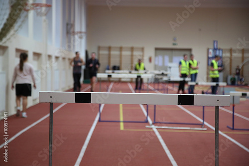 Barriers over a running track