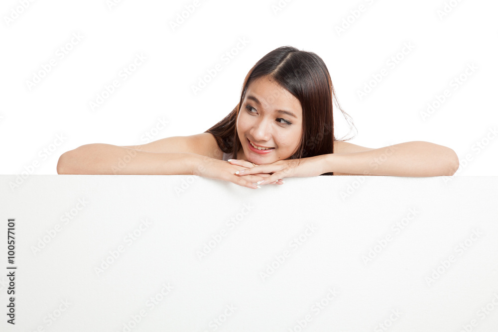 Beautiful young Asian woman behind a blank sign Beautiful young Asian woman behind a blank sign