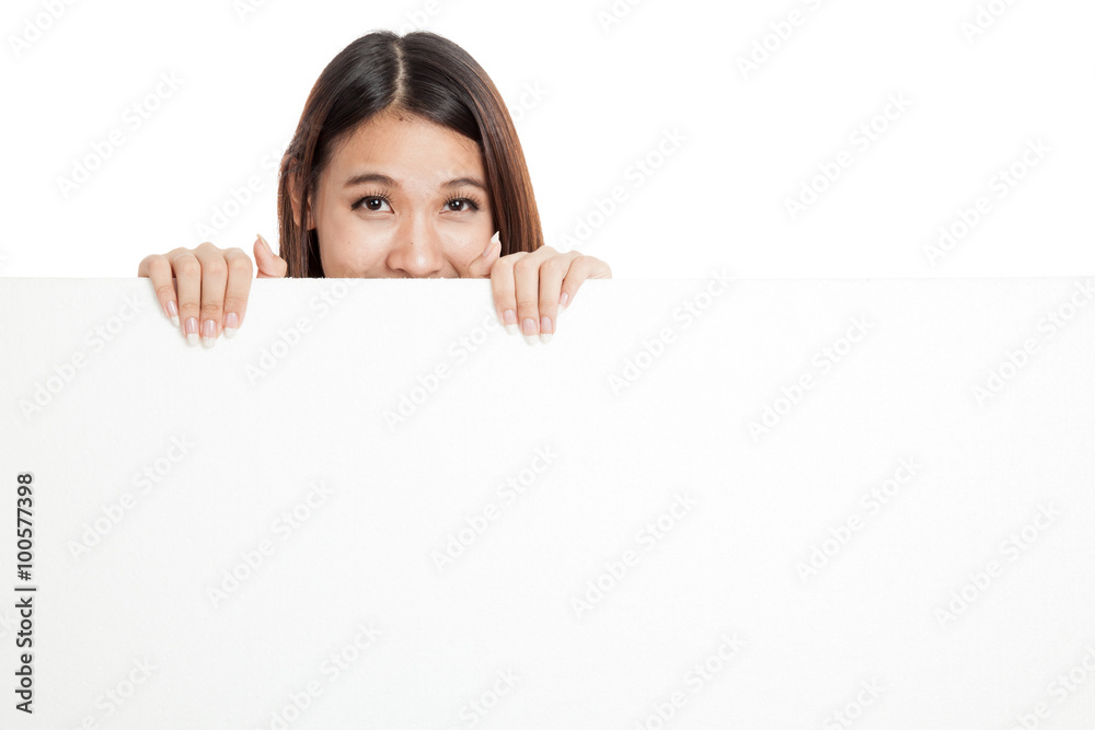 Beautiful young Asian woman behind a blank sign Beautiful young Asian woman behind a blank sign