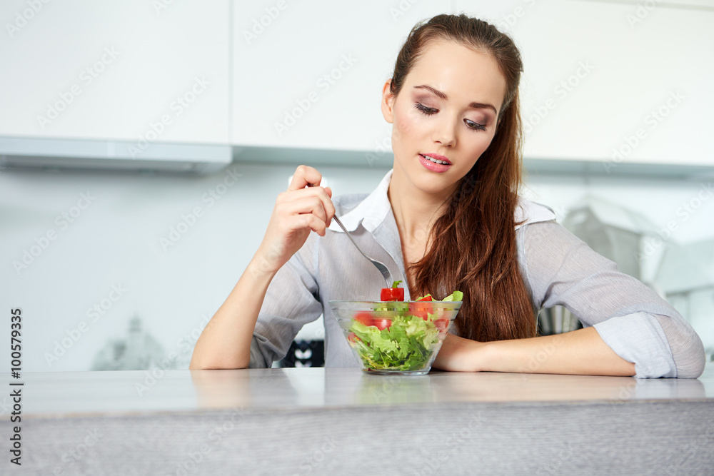 Beautiful Young Woman Eating Vegetable Salad .Dieting concept.He