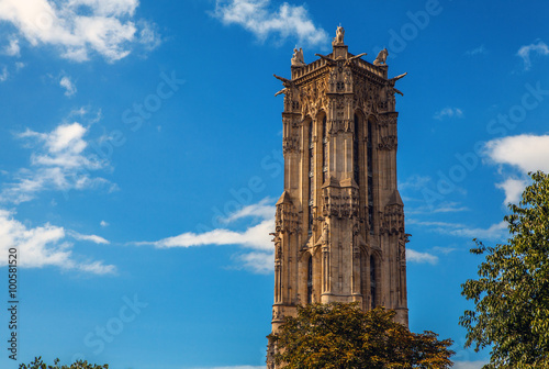 PARIS, FRANCE - AUGUST 30, 2015: Saint-Jacques Tower located on Rivoli street. This 52m Flamboyant Gothic tower is all that remains of former 16 century Church of Saint-Jacques-de-la-Boucherie. Paris. photo