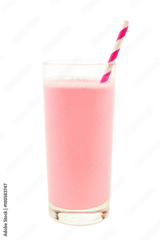 Strawberry milk in a glass with striped paper straw isolated on a white background Strawberry milk in a glass with striped paper straw isolated on a white background
