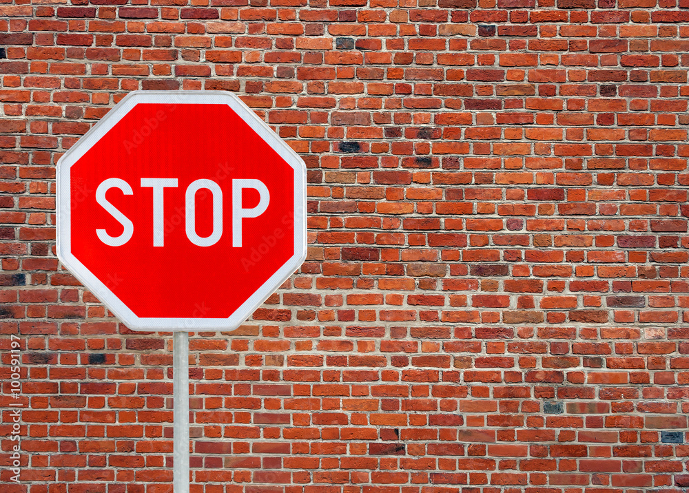 Stop sign on a brick wall background 1 Stop sign on a brick wall background 1
