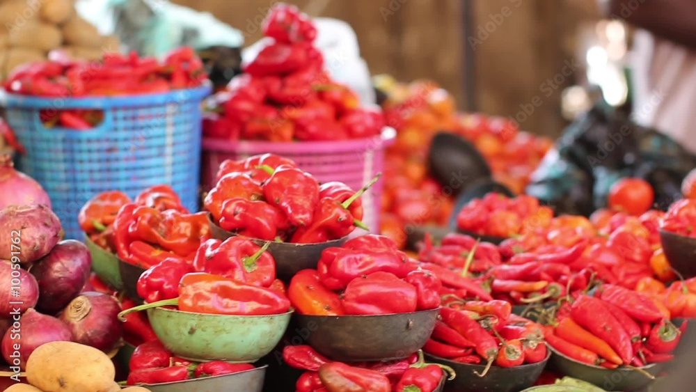 Tomato Pepper Onions and Irish potatoes on display in an Outdoor African Street Market Tomato Pepper Onions and Irish potatoes on display in an Outdoor African Street Market