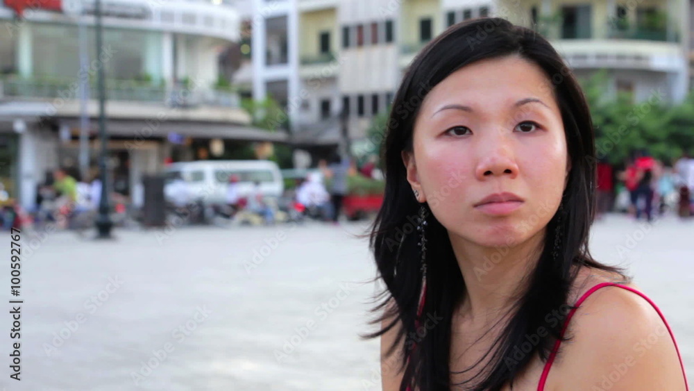 chinese young woman looking for something at city chinese young woman looking for something at city
