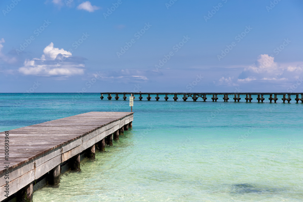 Wooden pier on tropical beach
