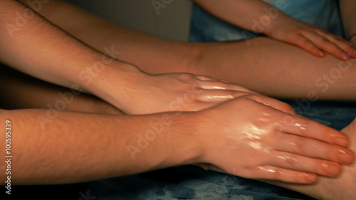 Wallpaper Mural Woman gets four hands Indian oil massage on her legs and foots. Manual alternative therapy for female wellness beauty relaxation and skin. 4K UHD video footage. Torontodigital.ca
