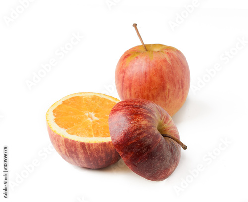 Apple orange inside GMO concept genetically modified fruit