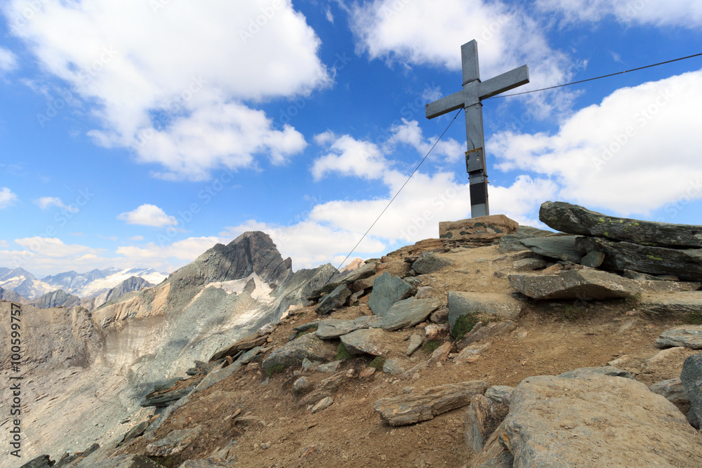 Summit cross on mountain Säulkopf and glacier panorama in Hohe Tauern Alps, Austria Summit cross on mountain Säulkopf and glacier panorama in Hohe Tauern Alps, Austria