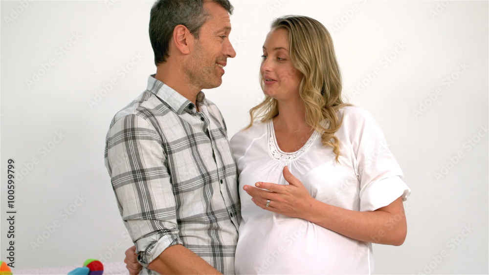 Man touching his pregnant wifes belly Man touching his pregnant wifes belly