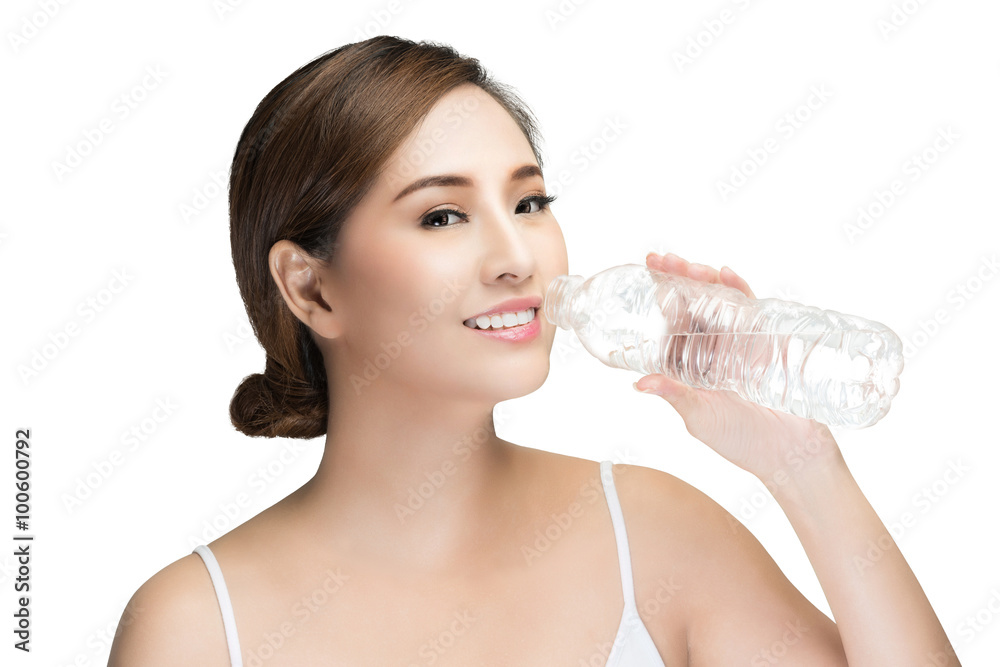 young Beautiful woman drinking water from plastic bottle,  isolated on white with clipping path.