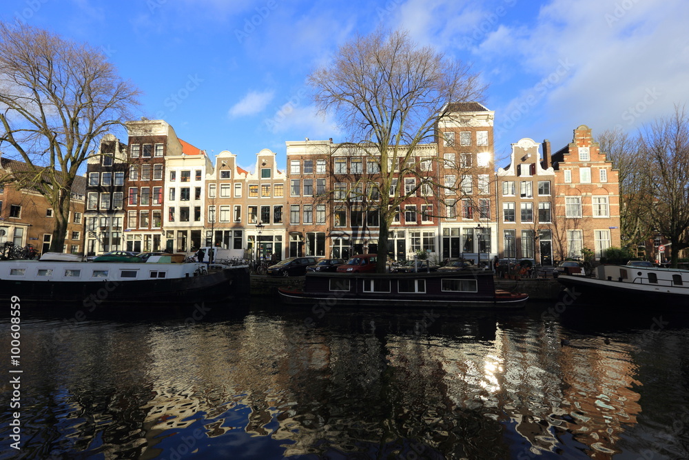 View of Amsterdam canal, typical dutch houses and boats, Holland, Netherlands. 
