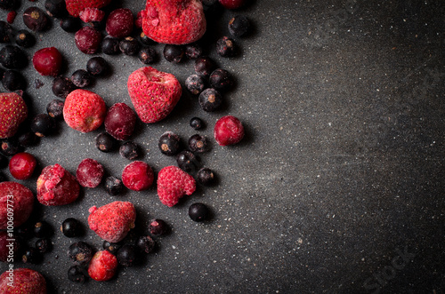 Frozen berries on dark background