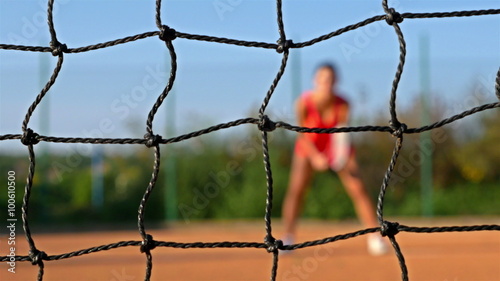 The body of a tennis player expecting the serving