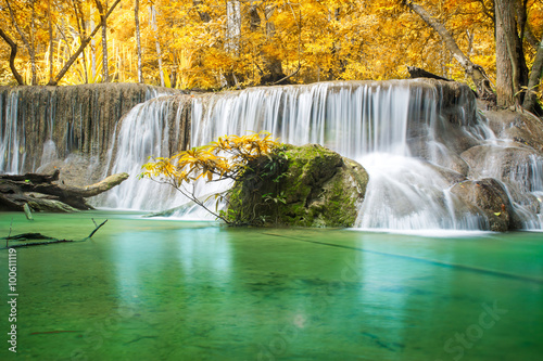 Beautiful waterfall in autumn forest 