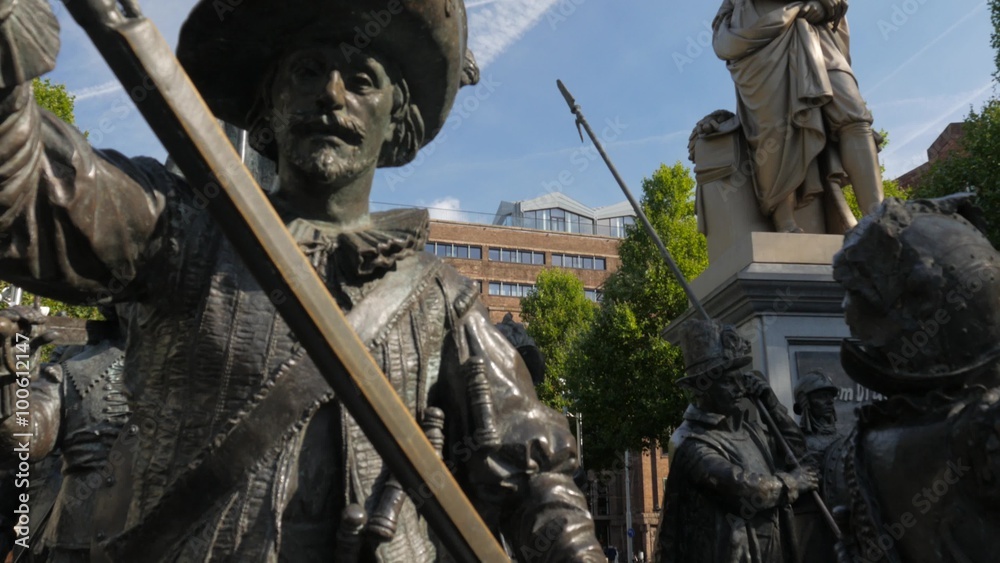 Tilt from Night Watch to Rembrandt Statue on Rembrandtplein Amsterdam. Shot on a sunny morning in 4K