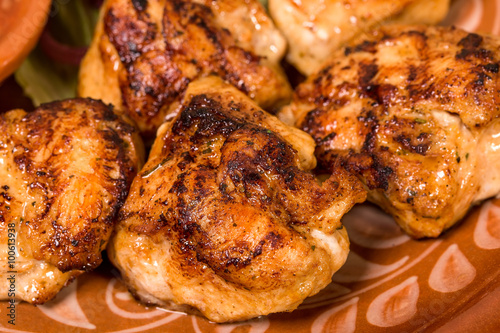 Closeup of grilled chicken thighs.
