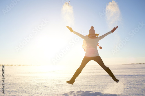 happy girl with a red scarf on the winter