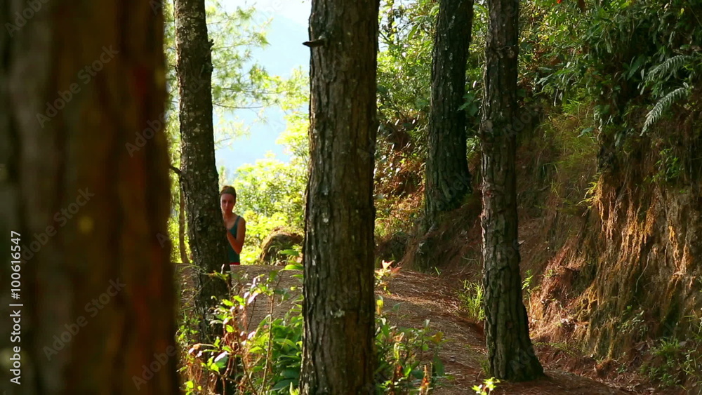 Sexy girl running along narrow footpath in forest Sexy girl running along narrow footpath in forest